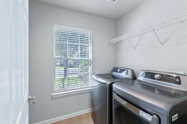 a utility room with dryer and washer