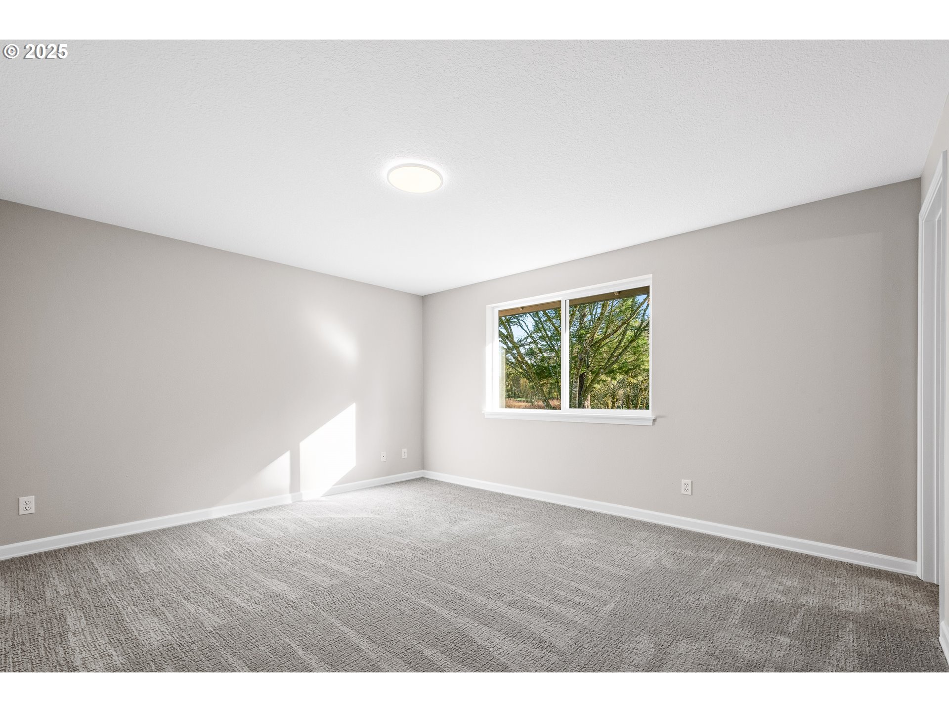 31030 Southwest Unger Road Cornelius, OR 97113 - Photo 14 of 25 a view of an empty room with wooden floor and a window