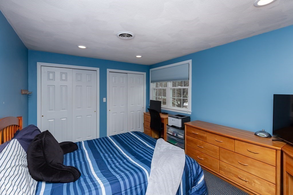 5 Williams Road Sharon, MA 02067 - Photo 16 of 34 a bedroom with a bed and a dresser in it