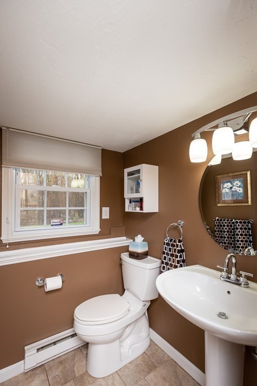 5 Williams Road Sharon, MA 02067 - Photo 25 of 34 a bathroom with a toilet a sink and a mirror