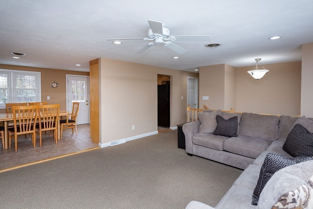 5 Williams Road Sharon, MA 02067 - Photo 4 of 34 a living room with furniture and a dining table