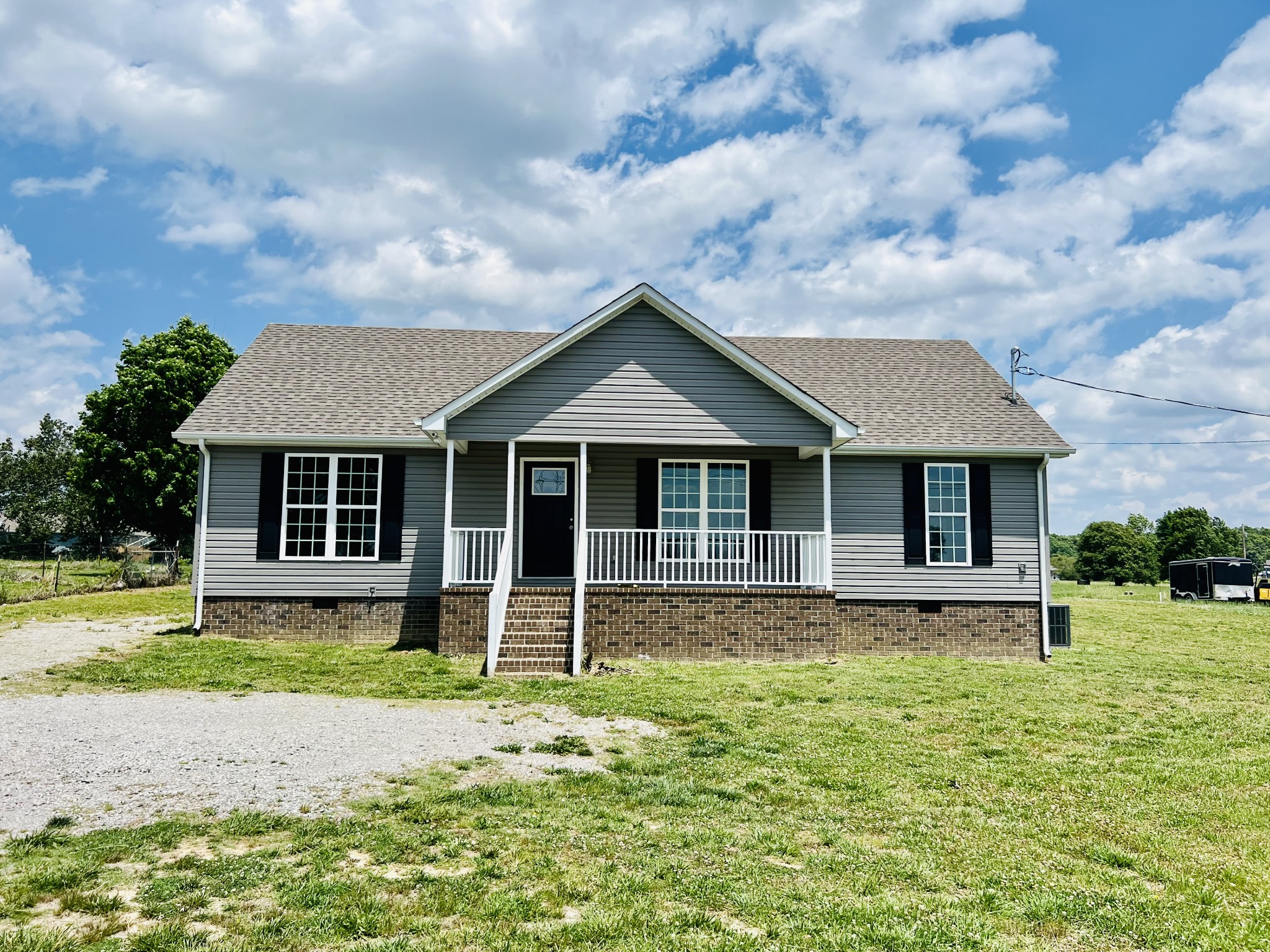 4560 Fall River Road Pulaski, TN 38478 - Photo 28 of 28 a front view of a house with a yard