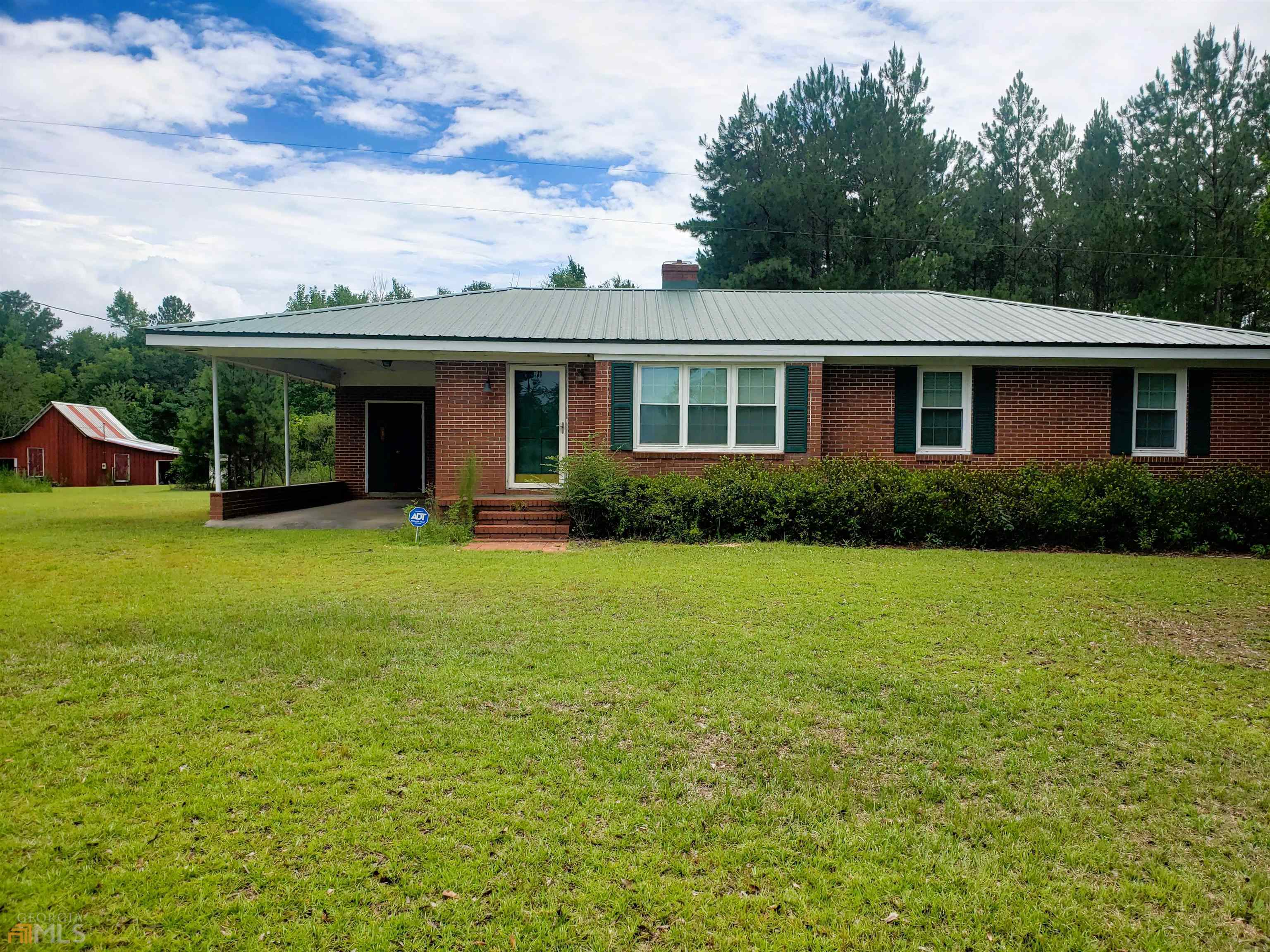 477 Alton Lawson Road Adrian, GA 31002 - Photo 1 of 1 a view of a house with backyard garden and swimming pool