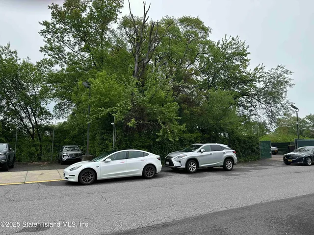a view of cars parked on a city street
