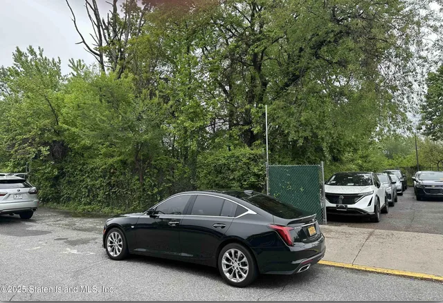 a car parked in front of a house