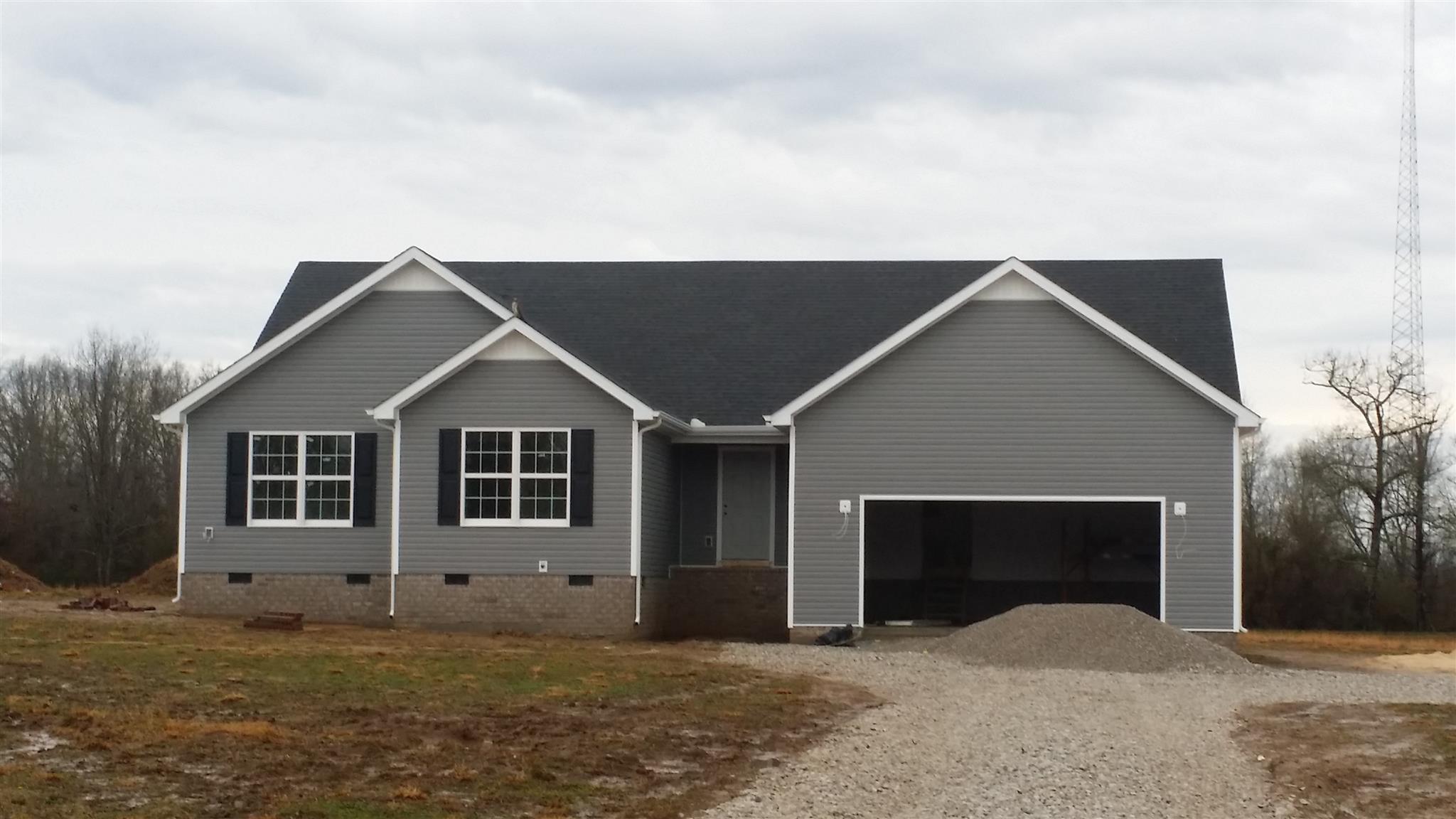 148 Houston Bell Road Manchester, TN 37355 - Photo 1 of 1 a front view of a house with a yard and garage