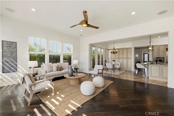 a spacious bedroom with a bed a table and large window