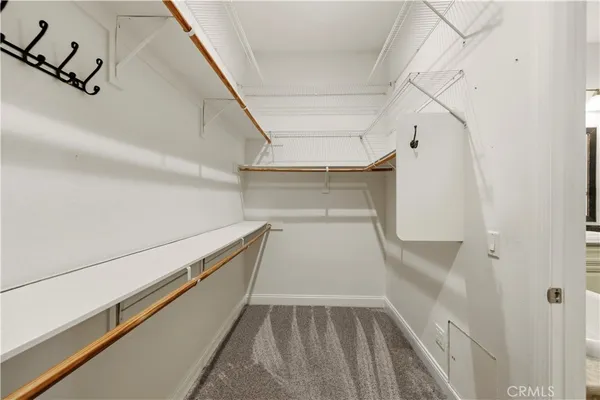 a bathroom with a sink toilet vanity and shower