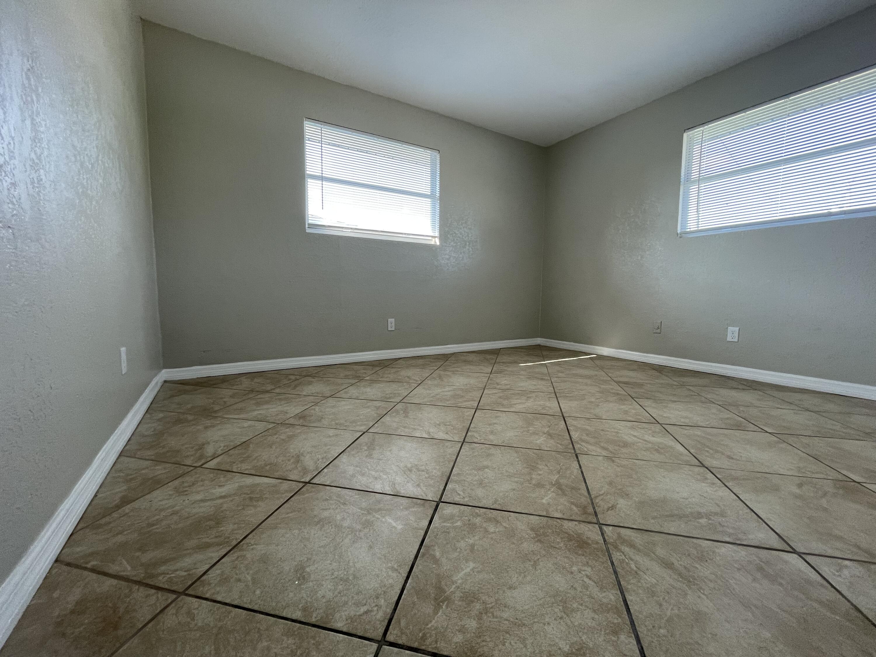 2880 Harson Way Fort Pierce, FL 34946 - Photo 31 of 40 a view of a room with white tiles and a window