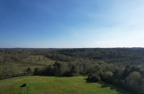 a view of a lake with a yard