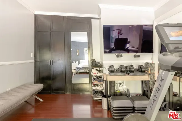 a bathroom with a sink mirror and shower