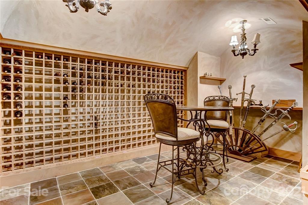 4701 Piper Glen Drive Charlotte, NC 28277 - Photo 40 of 47 a view of a dining room with furniture and chandelier