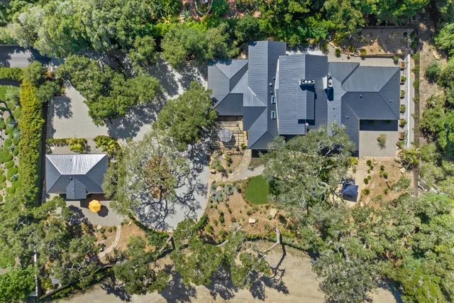 an aerial view of a house with yard and outdoor space