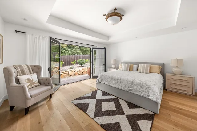 a bedroom with a bed and a couch