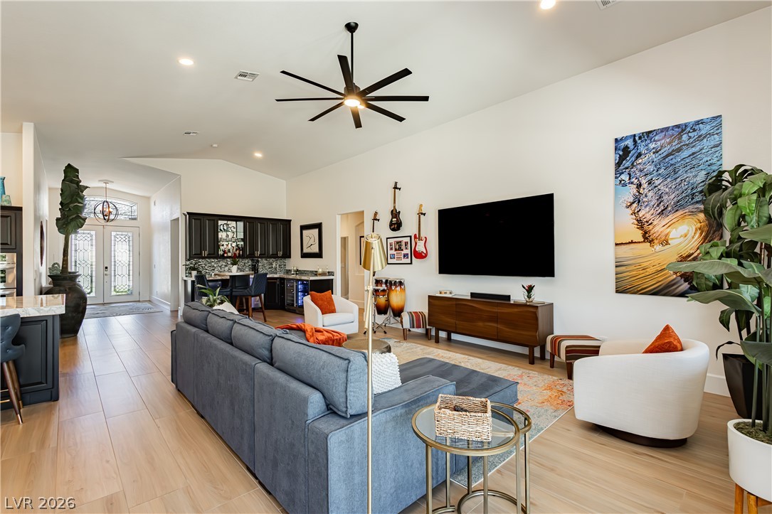 2256 Dogwood Ranch Avenue Henderson, NV 89052 - Photo 50 of 51 Step into a spacious living area featuring an inviting open floorplan and durable hardwood flooring.