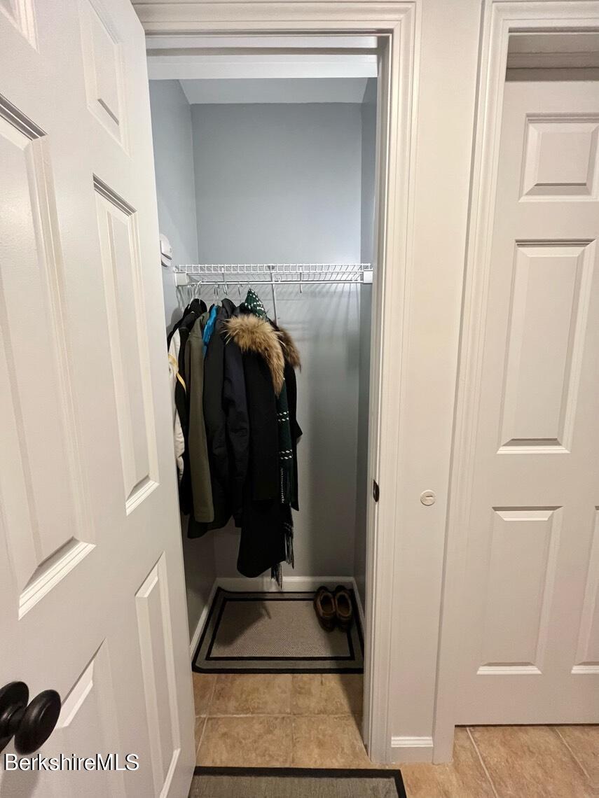 9212 Mountainside Drive Hancock, MA 01237 - Photo 17 of 44 a view of walk in closet with clothes and shoes