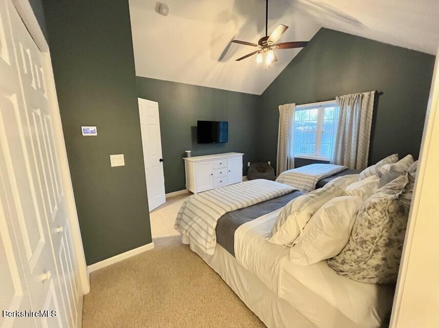 9212 Mountainside Drive Hancock, MA 01237 - Photo 20 of 44 a bedroom with a bed and a flat tv screen