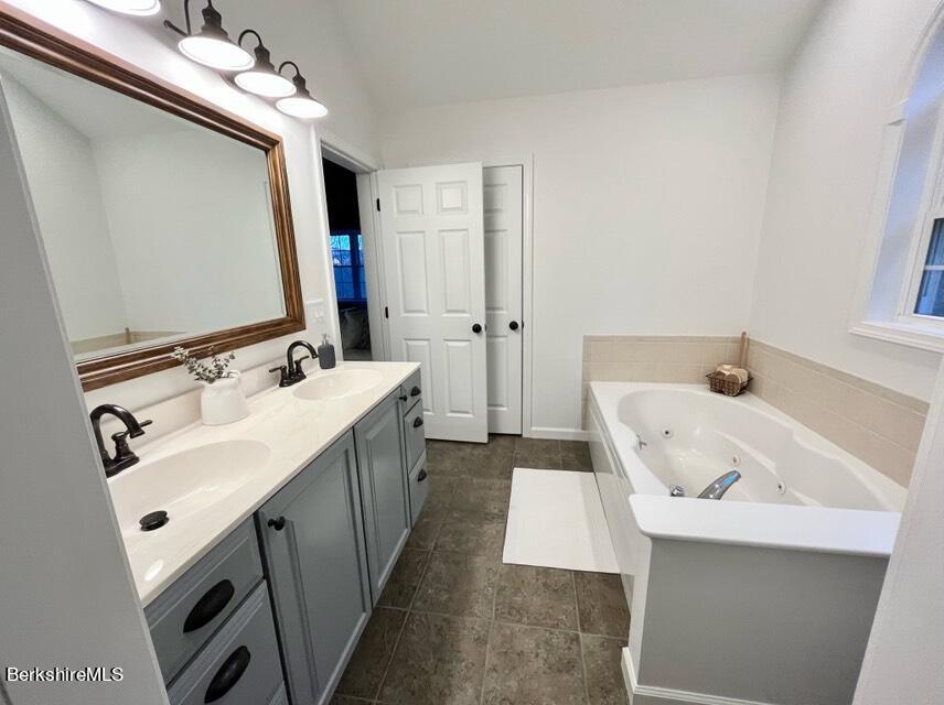 9212 Mountainside Drive Hancock, MA 01237 - Photo 21 of 44 a bathroom with a sink and a mirror