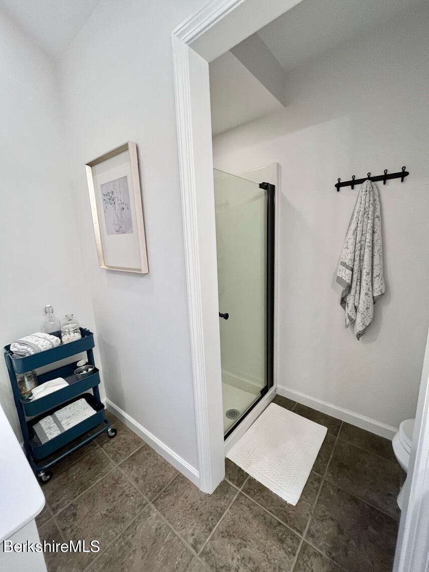 9212 Mountainside Drive Hancock, MA 01237 - Photo 22 of 44 a room with a window and gym equipment