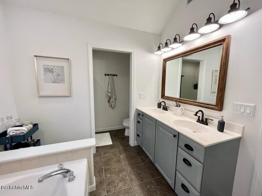9212 Mountainside Drive Hancock, MA 01237 - Photo 23 of 44 a bathroom with a double vanity sink mirror and