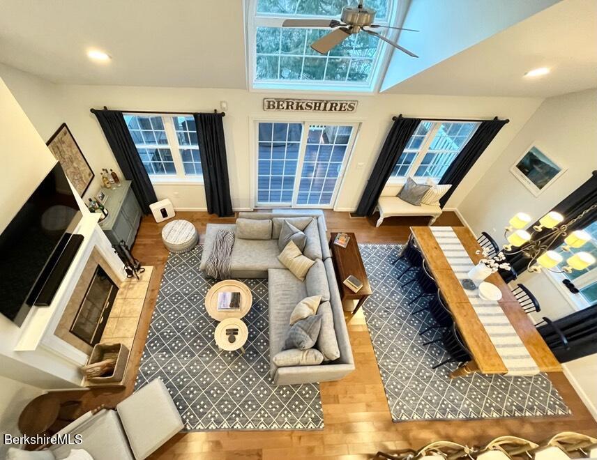 9212 Mountainside Drive Hancock, MA 01237 - Photo 25 of 44 a living room with furniture and a floor to ceiling window