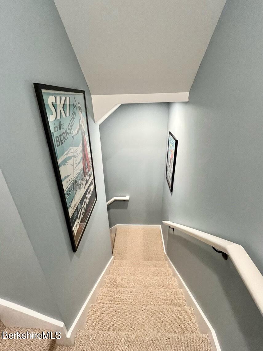 9212 Mountainside Drive Hancock, MA 01237 - Photo 27 of 44 a view of a hallway with paintings on the wall