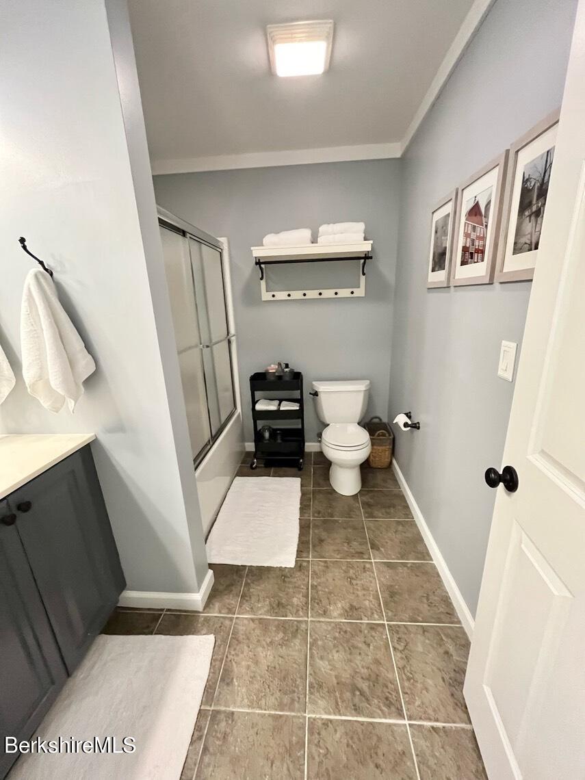 9212 Mountainside Drive Hancock, MA 01237 - Photo 36 of 44 a bathroom with a sink and a mirror