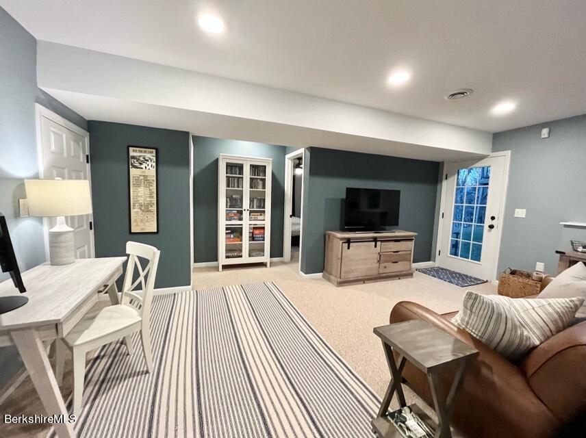 9212 Mountainside Drive Hancock, MA 01237 - Photo 38 of 44 a living room with furniture and a flat screen tv