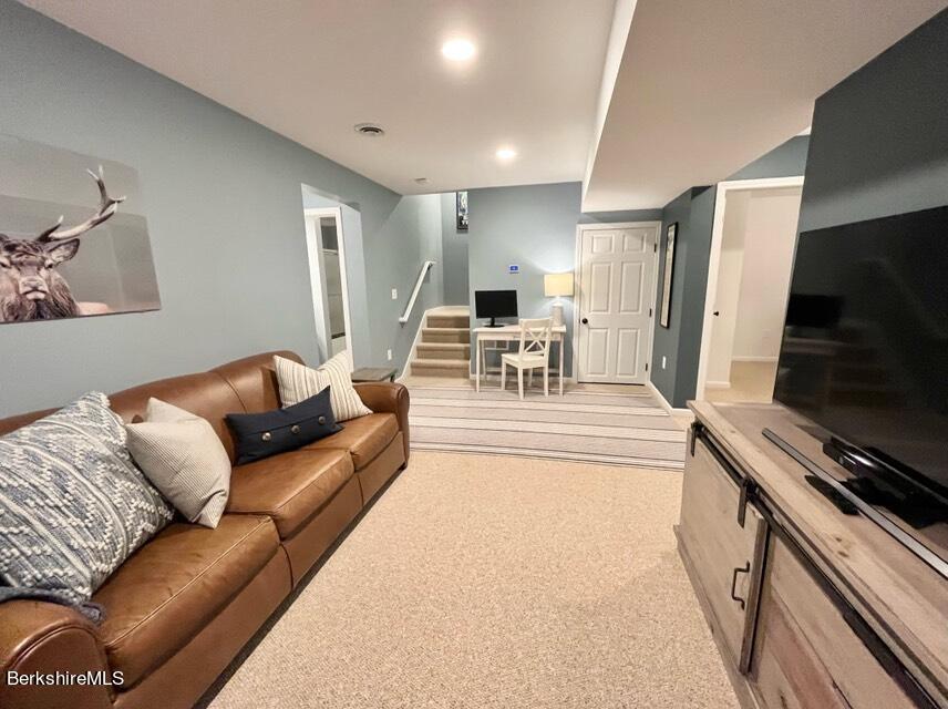 9212 Mountainside Drive Hancock, MA 01237 - Photo 39 of 44 a living room with furniture and a flat screen tv