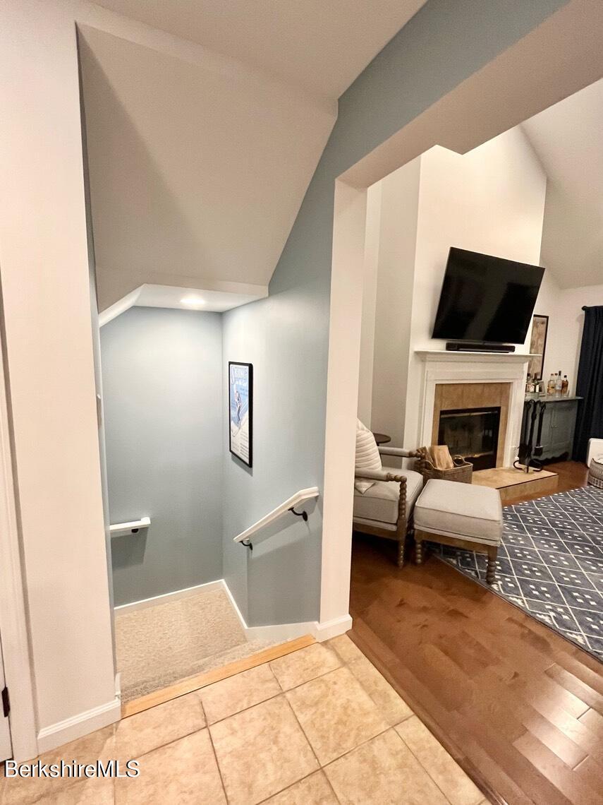 9212 Mountainside Drive Hancock, MA 01237 - Photo 41 of 44 a living room with furniture a fireplace and a flat screen tv