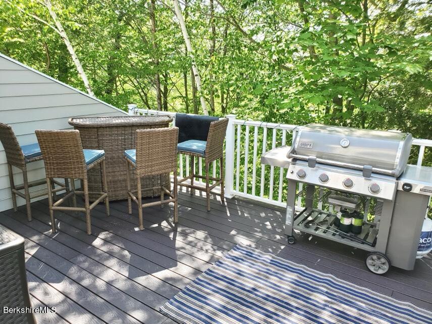 9212 Mountainside Drive Hancock, MA 01237 - Photo 42 of 44 a view of a chairs and table on the wooden deck