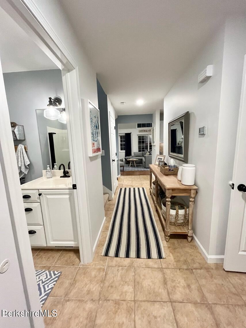 9212 Mountainside Drive Hancock, MA 01237 - Photo 6 of 44 a living room with furniture and a flat screen tv