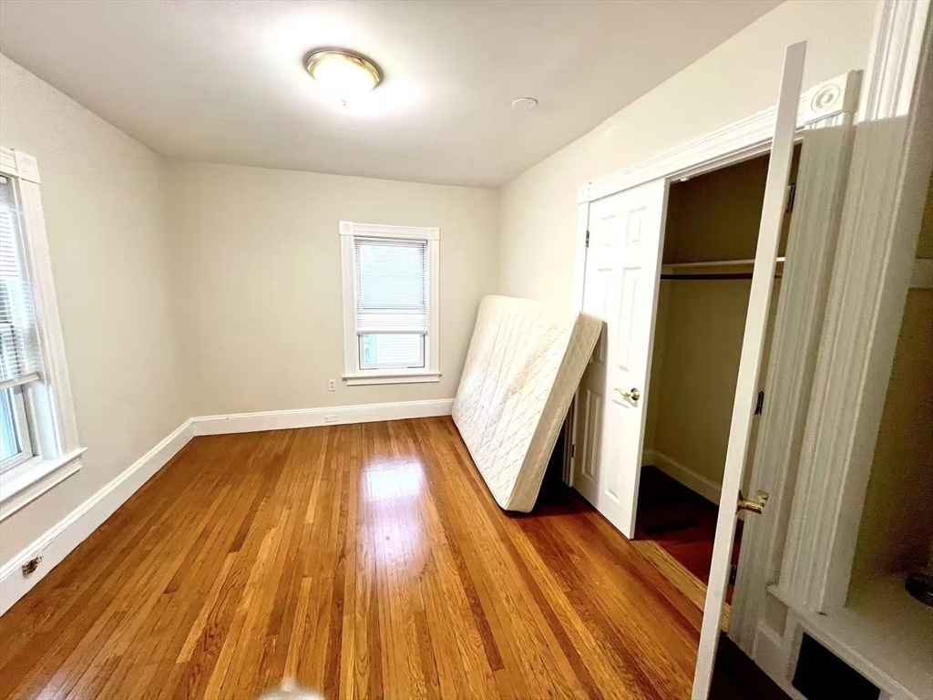 277 Whitwell Street, Unit 2 Quincy, MA 02169 - Photo 3 of 9 a view of a room with wooden floor and front door