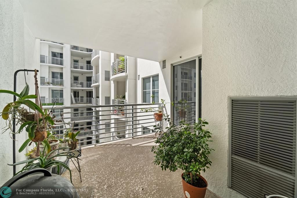 1830 Radius Drive, Unit 1017 Hollywood, FL 33020 - Photo 14 of 37 a front view of a house with a yard