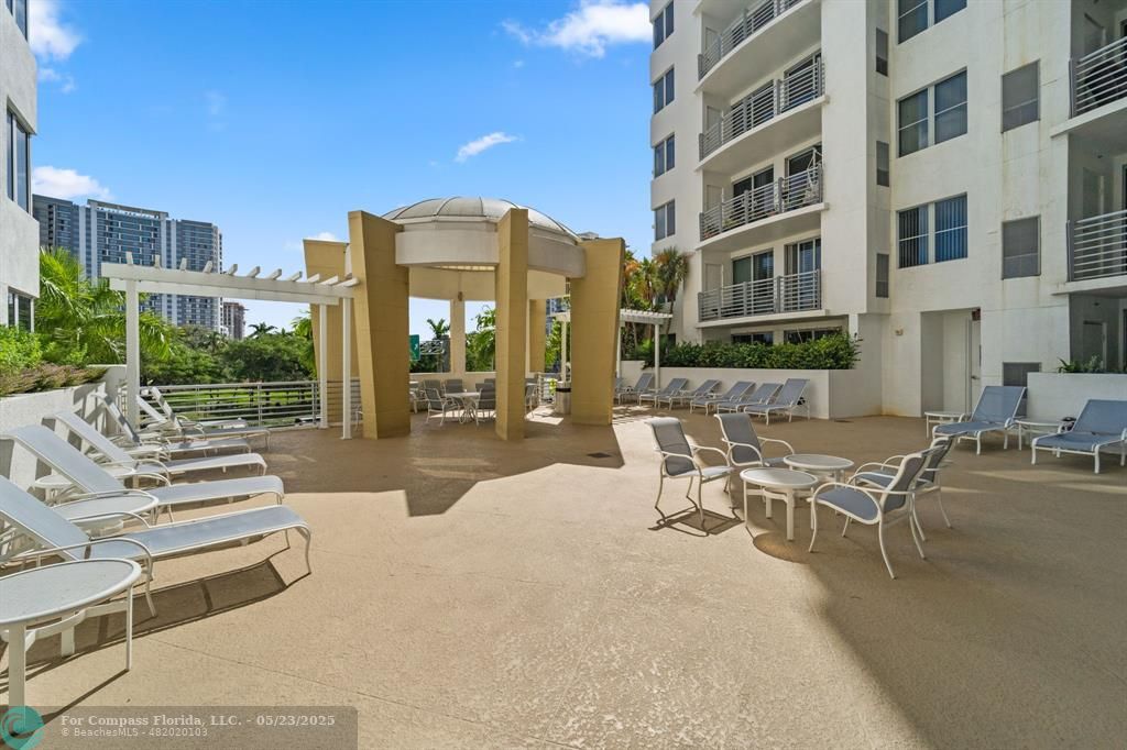 1830 Radius Drive, Unit 1017 Hollywood, FL 33020 - Photo 19 of 37 a view of a building with outdoor seating
