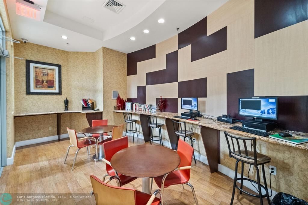 1830 Radius Drive, Unit 1017 Hollywood, FL 33020 - Photo 23 of 37 a view of a dining room with furniture and a kitchen