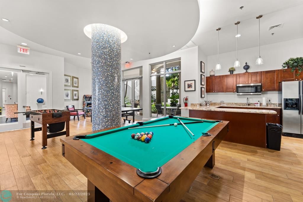 1830 Radius Drive, Unit 1017 Hollywood, FL 33020 - Photo 26 of 37 a room with pool table and windows