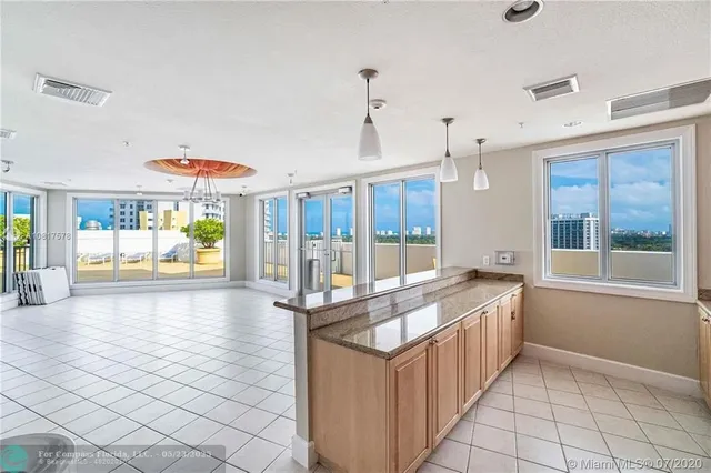 an aerial view of a house with a swimming pool
