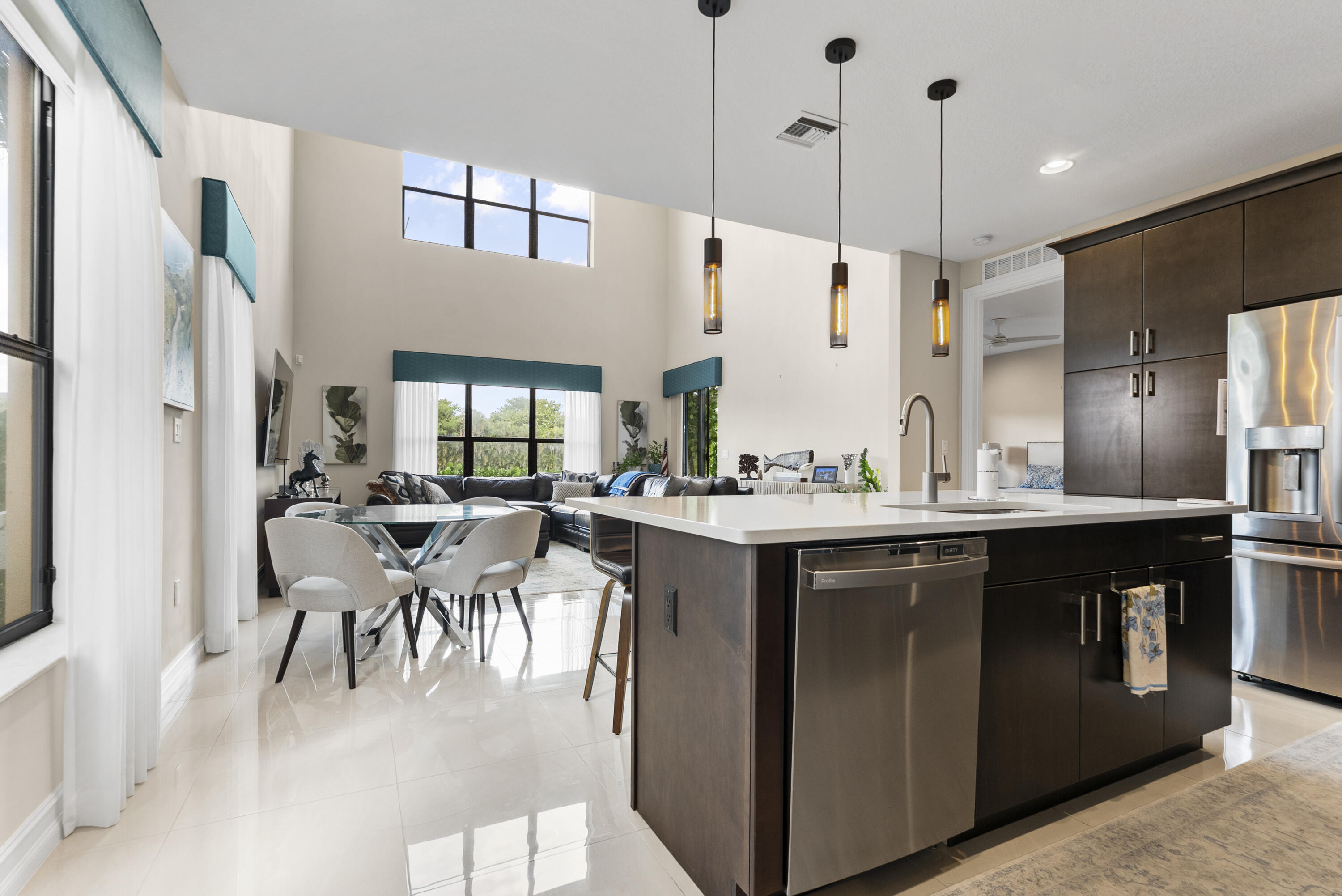 9941 Brickhill Drive Boca Raton, FL 33428 - Photo 1 of 48 a kitchen with a sink stove and chairs