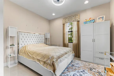 a view of a backyard with plants and a garden