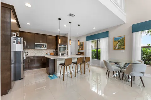 a kitchen with a sink and refrigerator