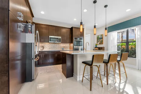 a view of a bedroom with wooden floor and stairs
