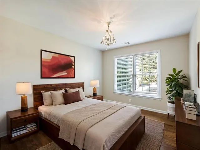 a bedroom with bed and window