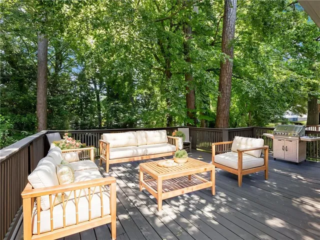 a view of a patio with a table and chairs