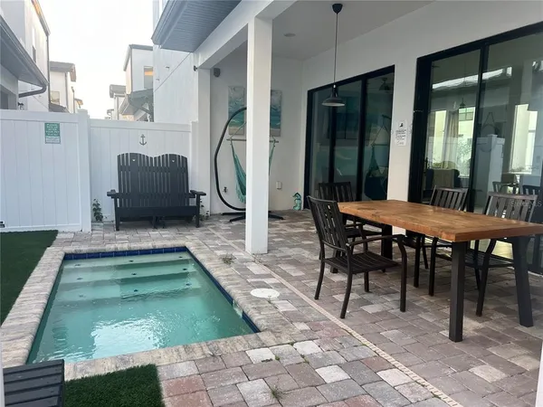 a outdoor dining space with furniture