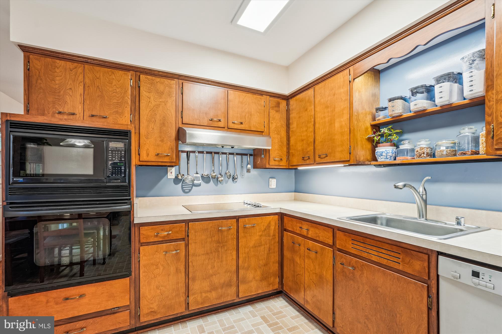 16523 Kipling Road Rockville, MD 20855 - Photo 11 of 50 a kitchen with stainless steel appliances granite countertop a sink stove and cabinets