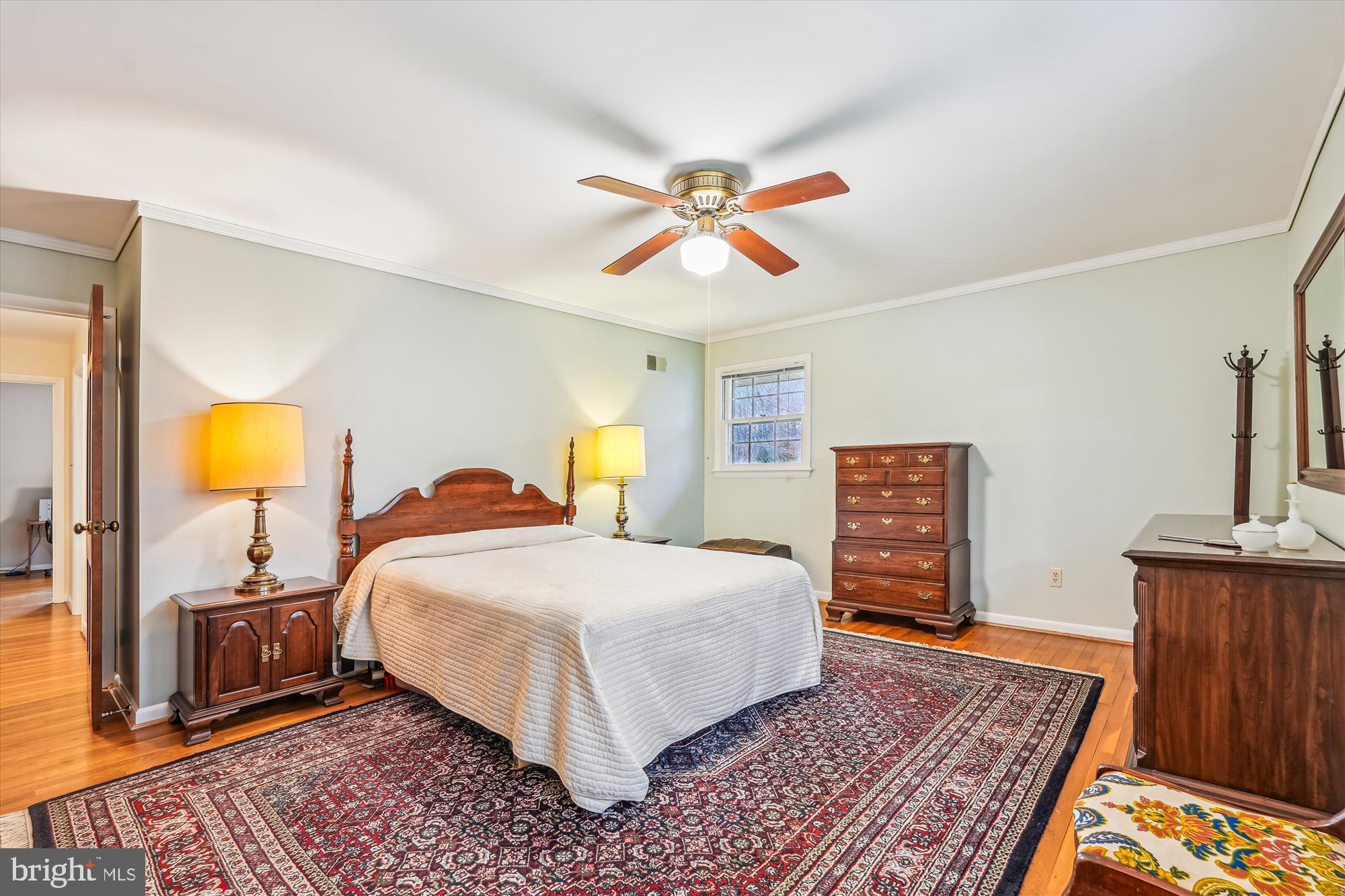 16523 Kipling Road Rockville, MD 20855 - Photo 17 of 50 a bedroom with a bed and wooden floor