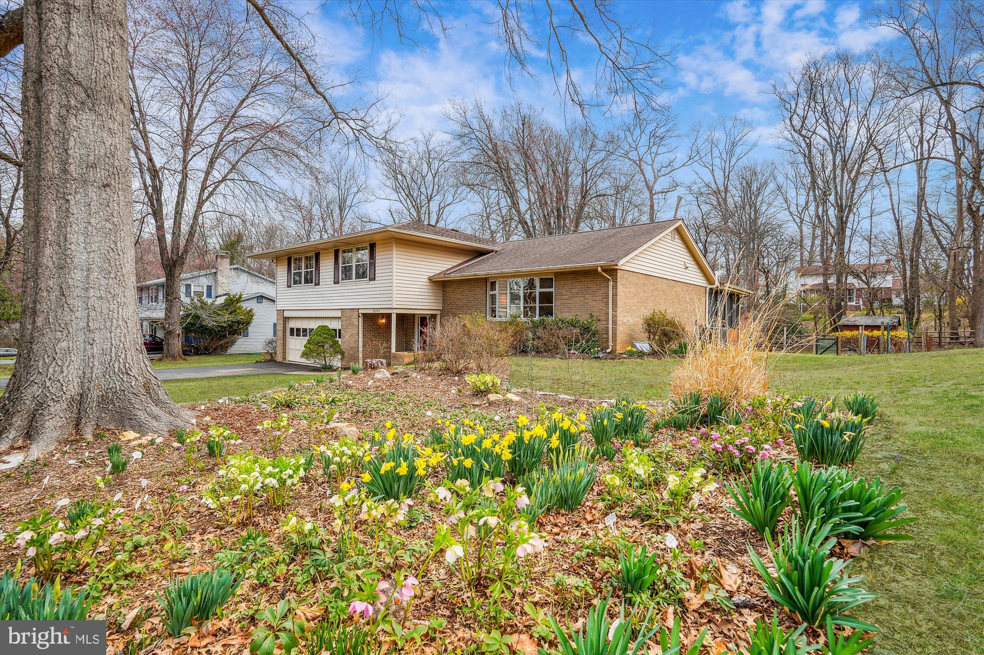 16523 Kipling Road Rockville, MD 20855 - Photo 2 of 50 a front view of a house with a yard