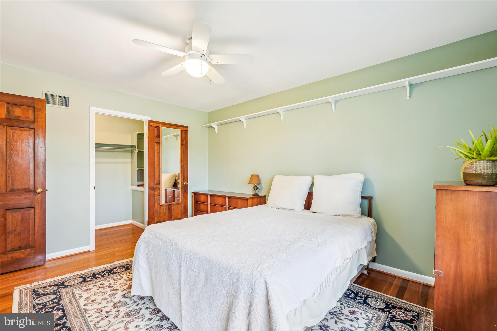 16523 Kipling Road Rockville, MD 20855 - Photo 23 of 50 a bedroom with a bed and a table in it