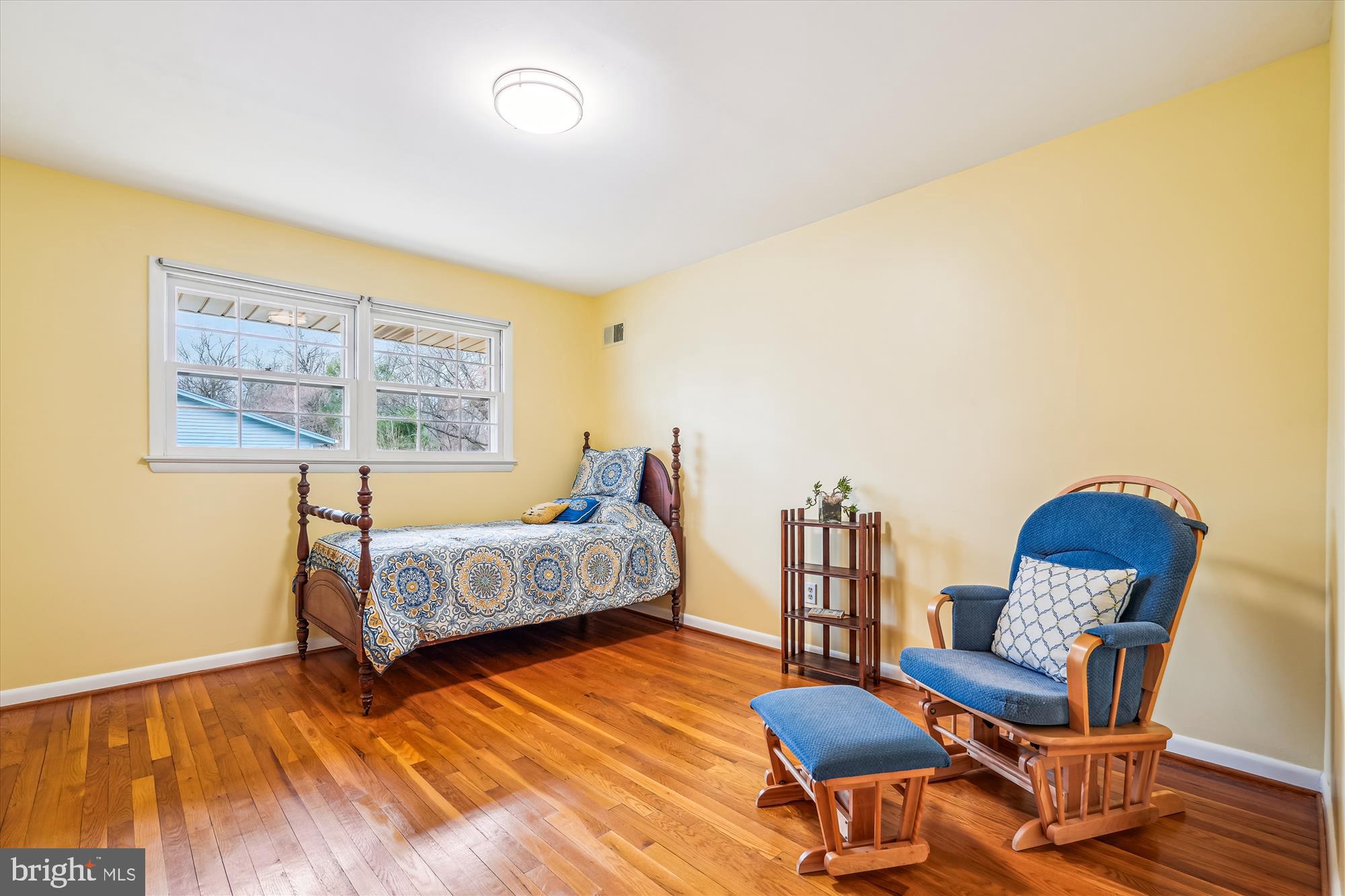 16523 Kipling Road Rockville, MD 20855 - Photo 24 of 50 a bedroom with furniture and a wooden floor
